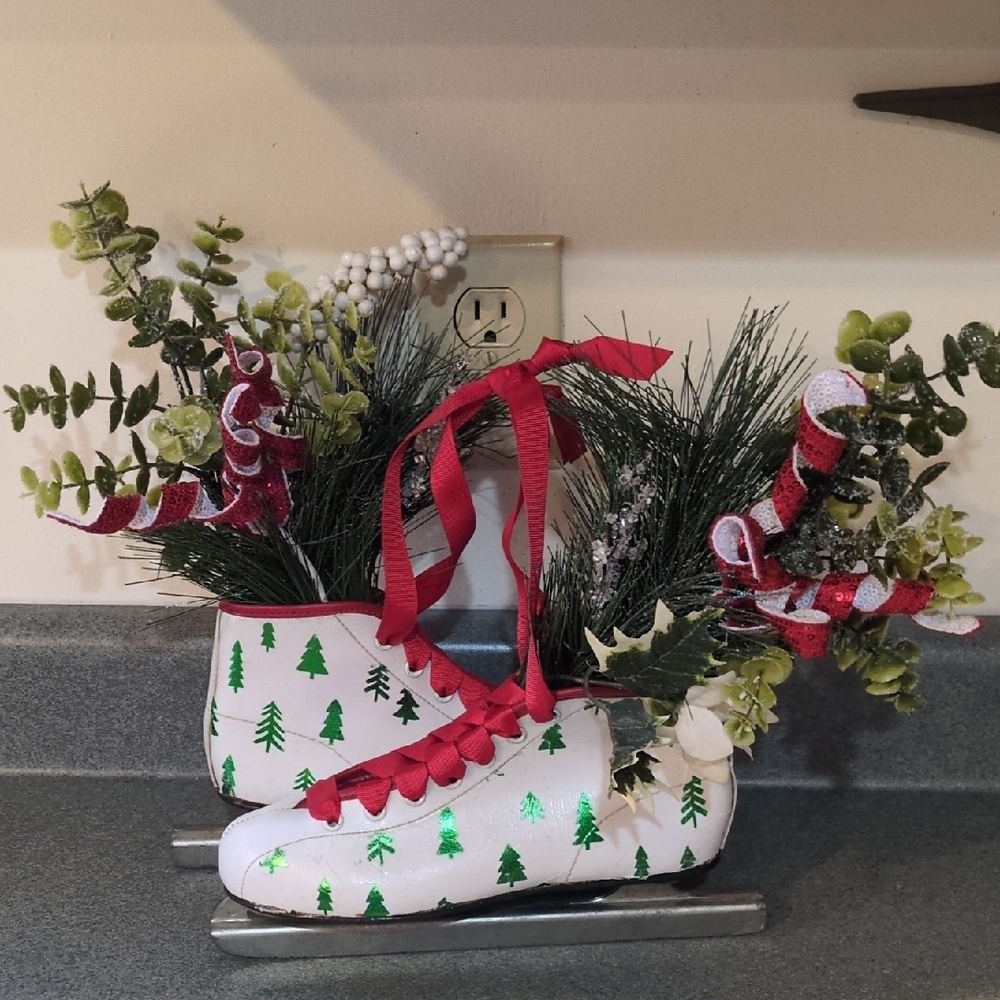 Festive Ice Skate Decor with Greenery and Red Accents